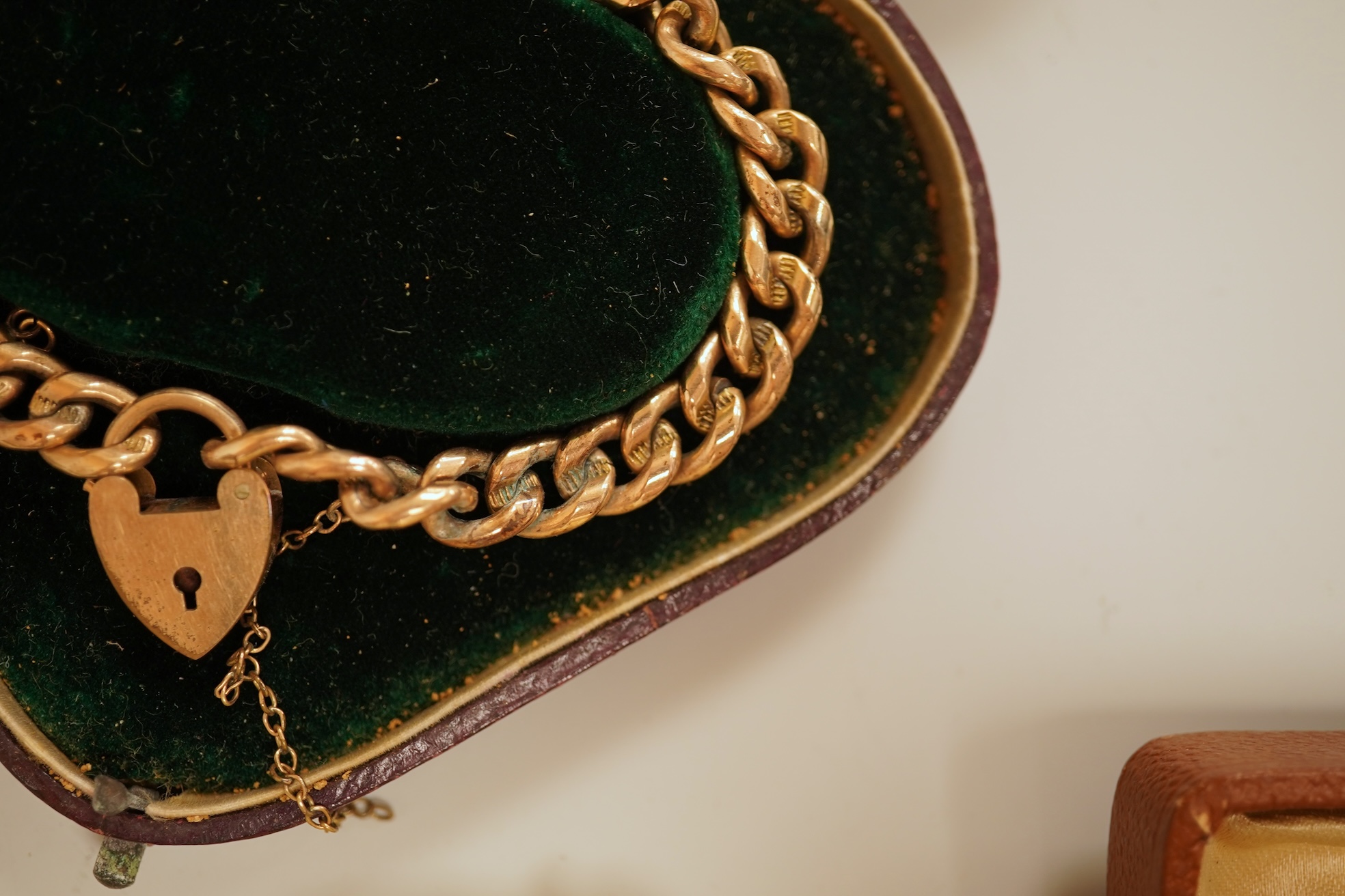 A small group of assorted jewellery including a gold plated curb link bracelet, silver brooch, simulated pearl necklace and costume.